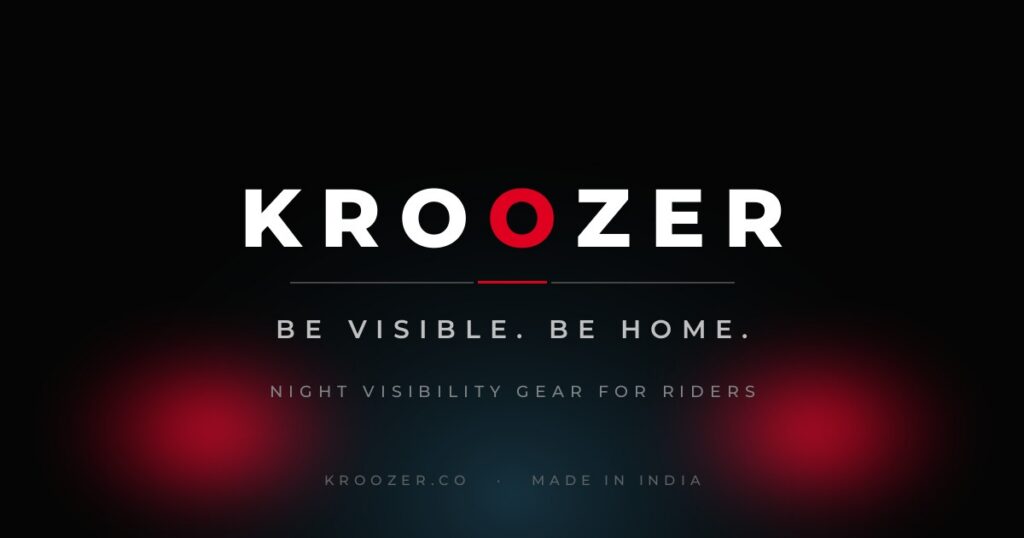 Kroozer brand card: the KROOZER wordmark in white on a dark background, with two red strobe pulses low on either side and the line Be visible. Be home.