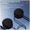 Close up of the two round black speaker pads of the Bluetooth BTX, with text about connecting two phones at the same time
